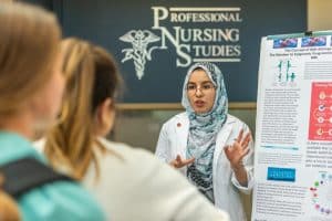 Ladiba Said Nafe speaks to fellow students about her nursing research.