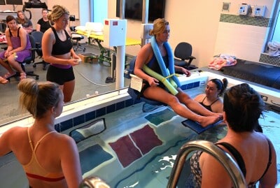 Students work at the pool in the Human Performance Lab