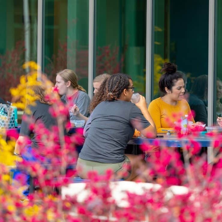 Students gather outside the McLean Health Sciences Building