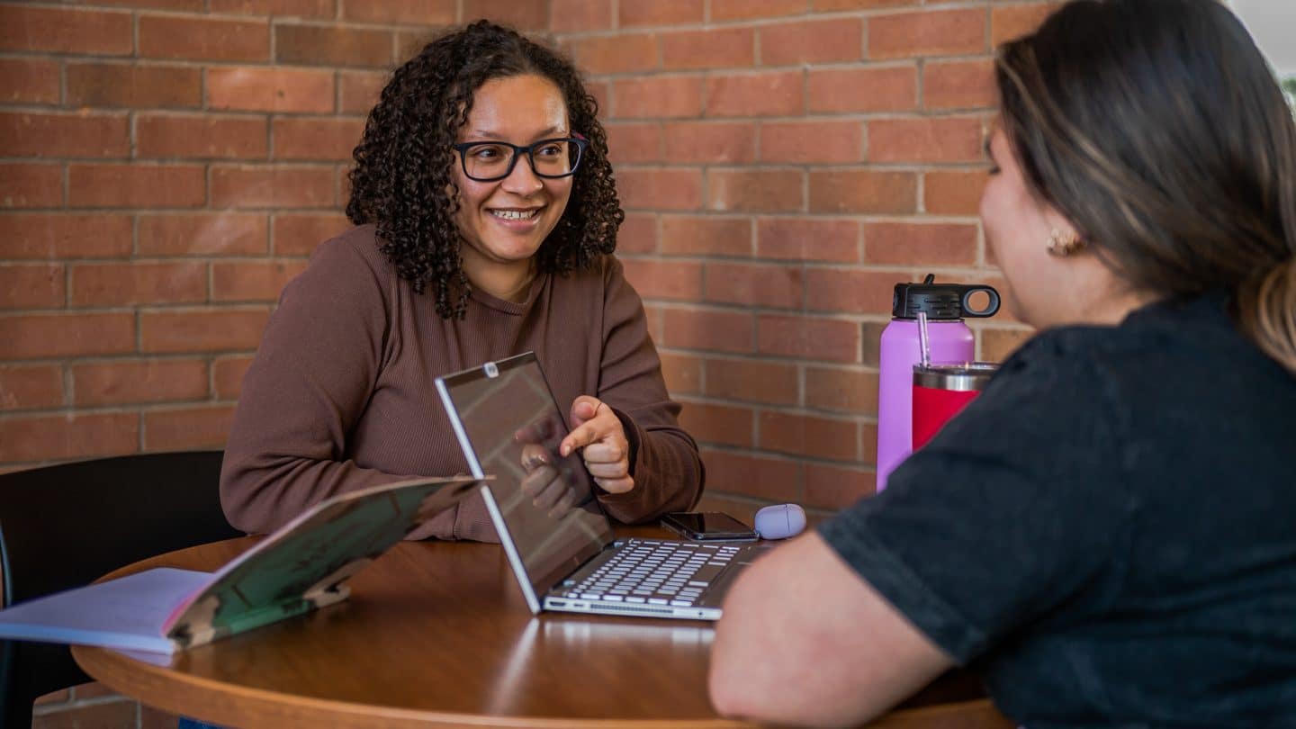 Students converse in Davis Memorial Library