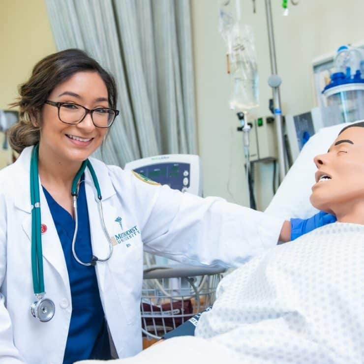 A student works with a manakin in the General Simulation Hospital of the Robert J. Chaffin Nursing Building