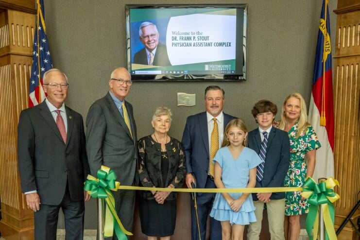 Participating in the ribbon-cutting ceremony for the newly named Dr. Frank P. Stout Physician Assistant Complex at Methodist University were (L/R): Tim Richardson (Vice Chair of the MU Board of Trustees), Dr. Stanley T. Wearden (MU President); Carol Stout (wife of the late Dr. Stout); Cam Stout (son of Dr. Stout); Cameron Stout (granddaughter of Dr. Stout); Craven Stout (grandson of Dr. Stout); Kelly Stout (daughter in-law of Dr. Stout).