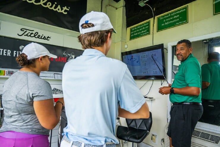 Head Professional Chris Brown instructs students