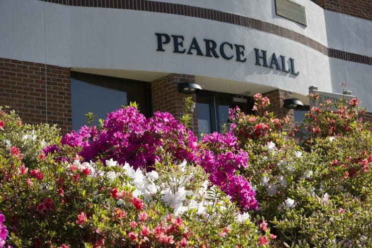 Pearce Hall with springtime flowers