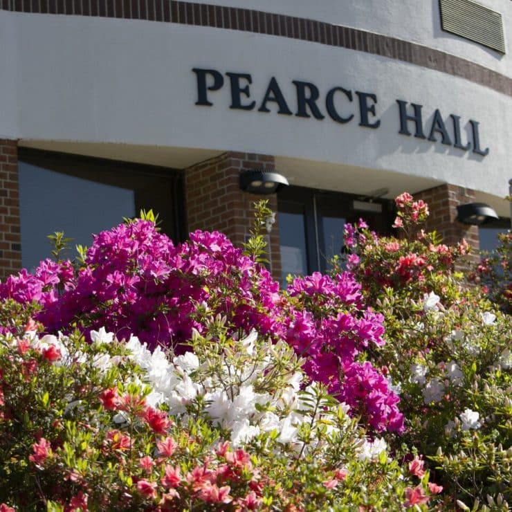 Pearce Hall with springtime flowers
