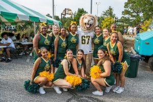 King Mascot with Cheerleaders