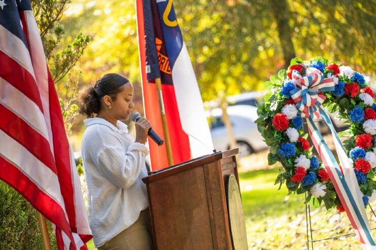 A student speaks at the annual Veterans Day Ceremony
