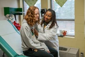Lynetta Allen-Geddie treats a student