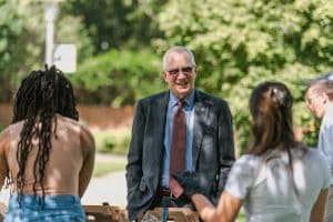 Dr. Stanley T. Wearden chats with students