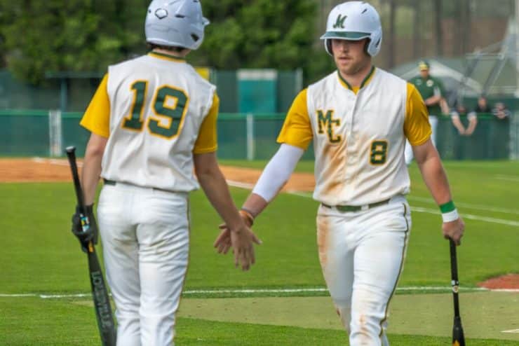 Monarch Baseball players congratulate each other