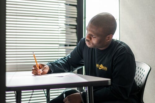 A student takes an exam in the Testing Center