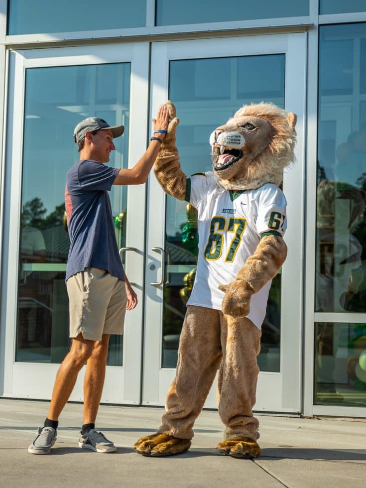 A new student high-fives King