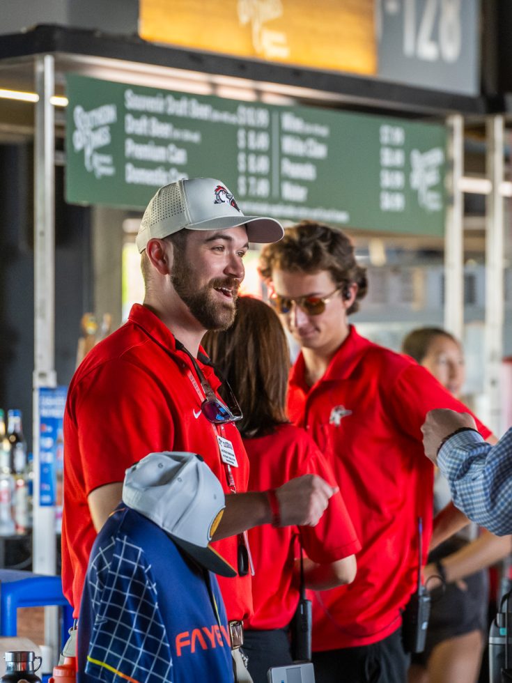 Student interns at a Woodpeckers game