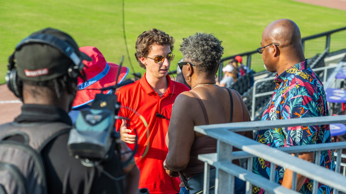 Student interns at a Woodpeckers game