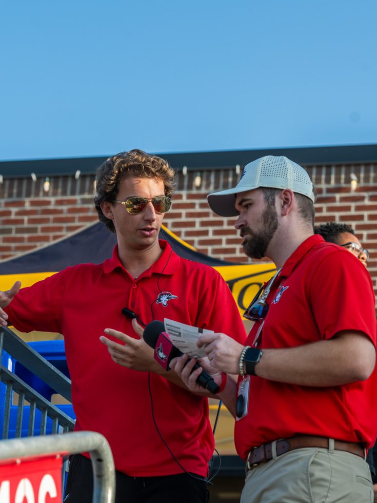 Student interns at a Woodpeckers game