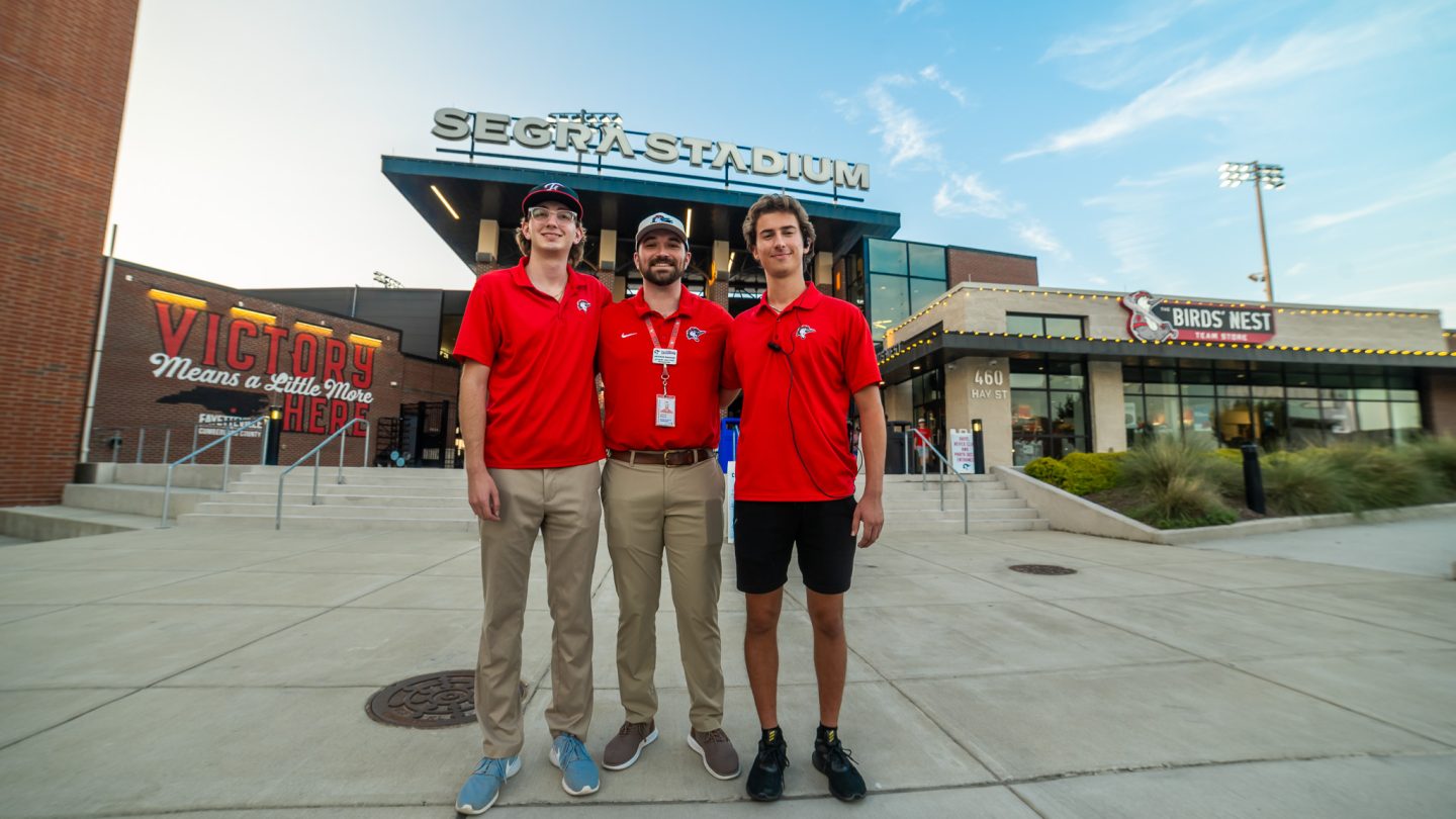 Student interns at a Woodpeckers game