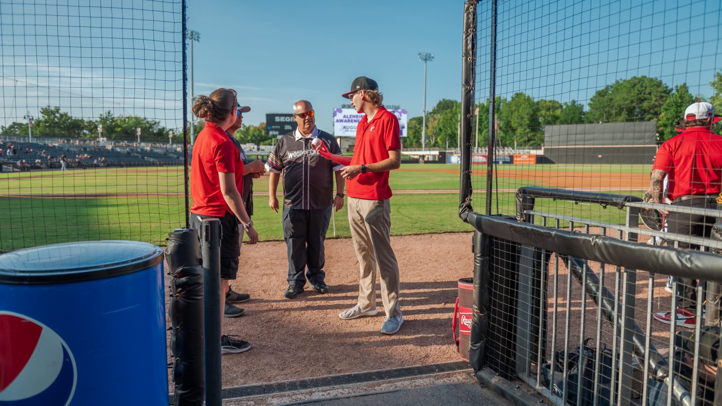 Student interns at a Woodpeckers game