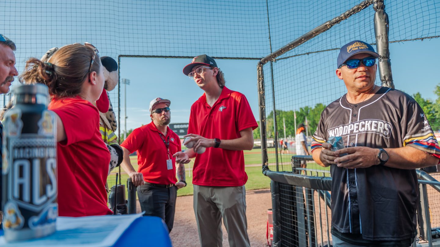 Student interns at a Woodpeckers game