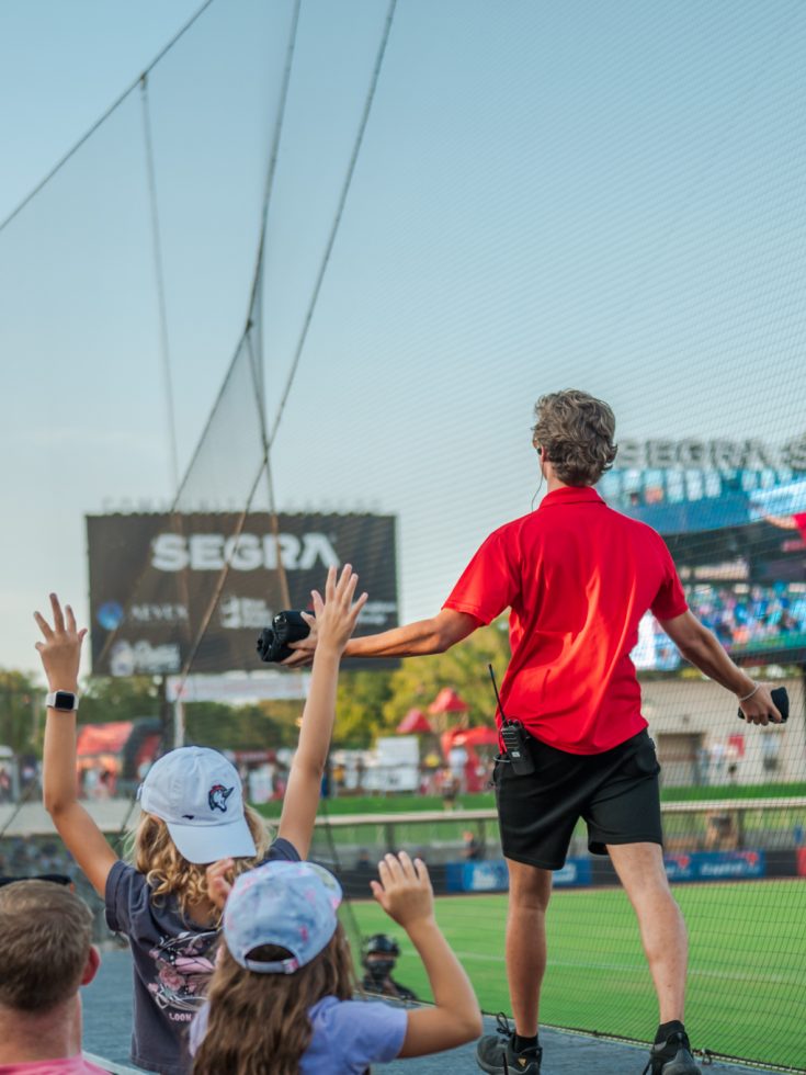 Student interns at a Woodpeckers game