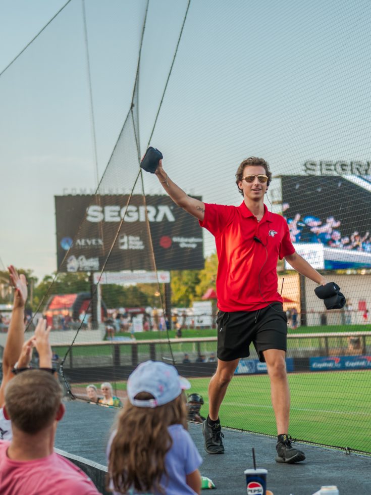 Student interns at a Woodpeckers game