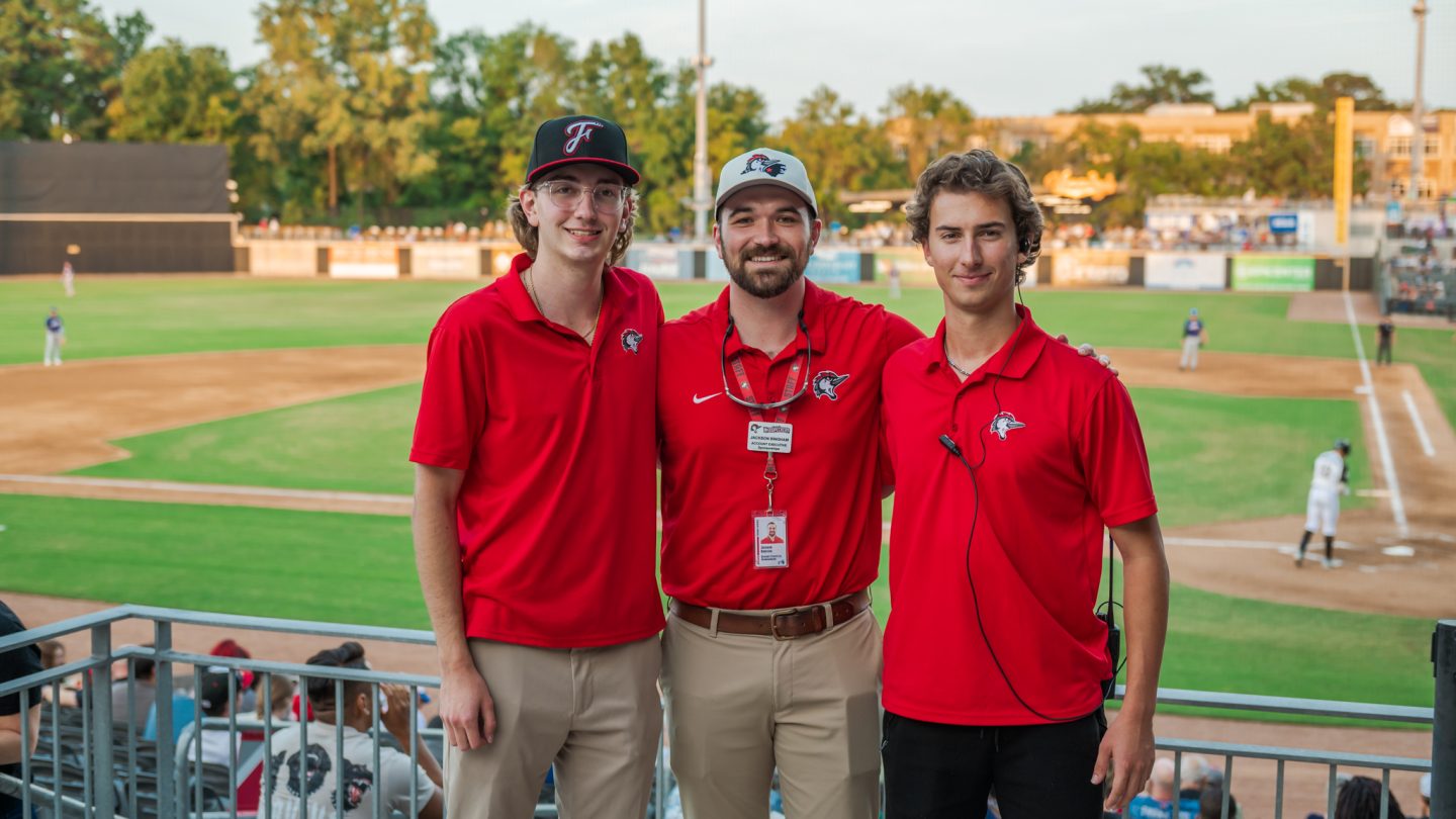 Student interns at a Woodpeckers game