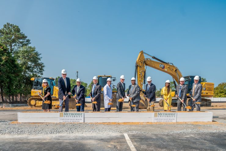 The speakers at Tuesday's groundbreaking included (L-R) Dr. Suzanne Blum Malley (Provost, Methodist University); Dr. Franklin Clark III (Chair, Methodist University Cape Fear Valley Health School of Medicine, Inc.); Dr. Rakesh Gupta (Board Chair, Methodist University); Michael Nagowski (CEO, Cape Fear Valley Health); Dr. Hershey Bell (Founding Dean, Methodist University Cape Fear Valley Health School of Medicine); Dr. Stanley T. Wearden (President, Methodist University); Glenn Adams (Chair, Cumberland County Commissioner and Board Member, Cape Fear Valley Health); Jimmy Keefe (Cumberland County Commissioner and Vice Board Chair, Cape Fear Valley Health); Dr. Toni Stewart (Vice Chair, Cumberland County Commissioner and Board Member, Cape Fear Valley Health); Brian Raynor (Golden LEAF Foundation); Scott Hamilton (Golden LEAF Foundation)