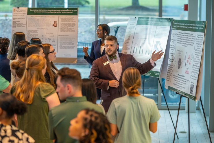 A student makes a presentation at the 2024 Doctor of Physical Therapy Program Poster Presentations