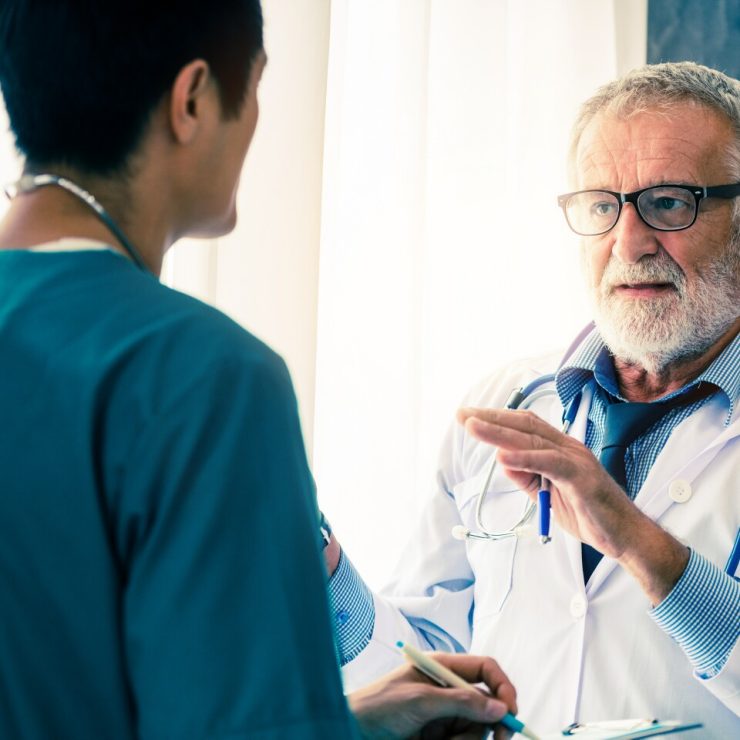 A Medical School professor consults with a student