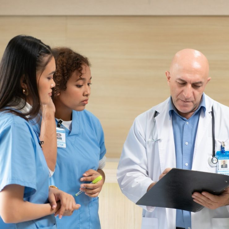 A Medical School professor consults with students