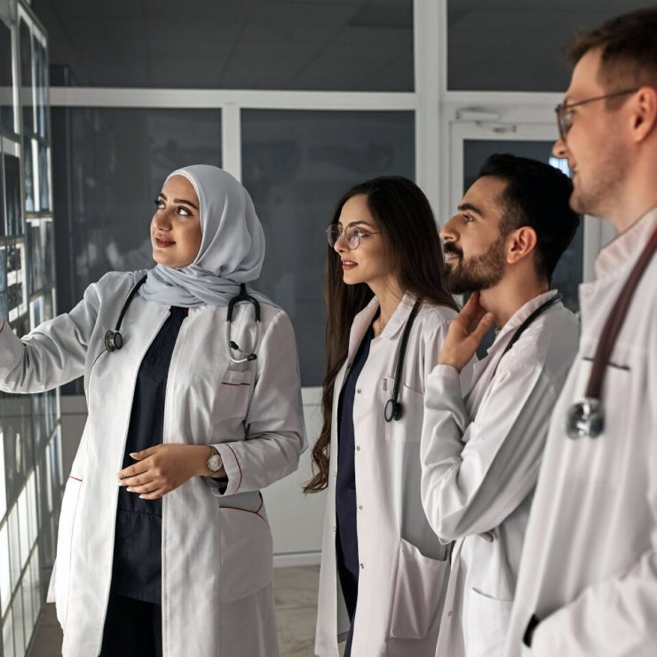 A Medical School professor consults with students