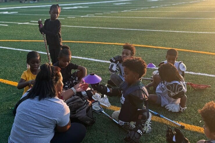 Zhane Ruffin with child athletes