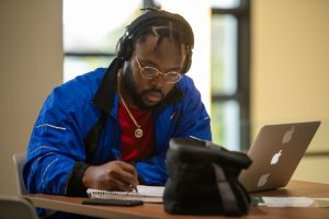 A student uses his laptop in the library