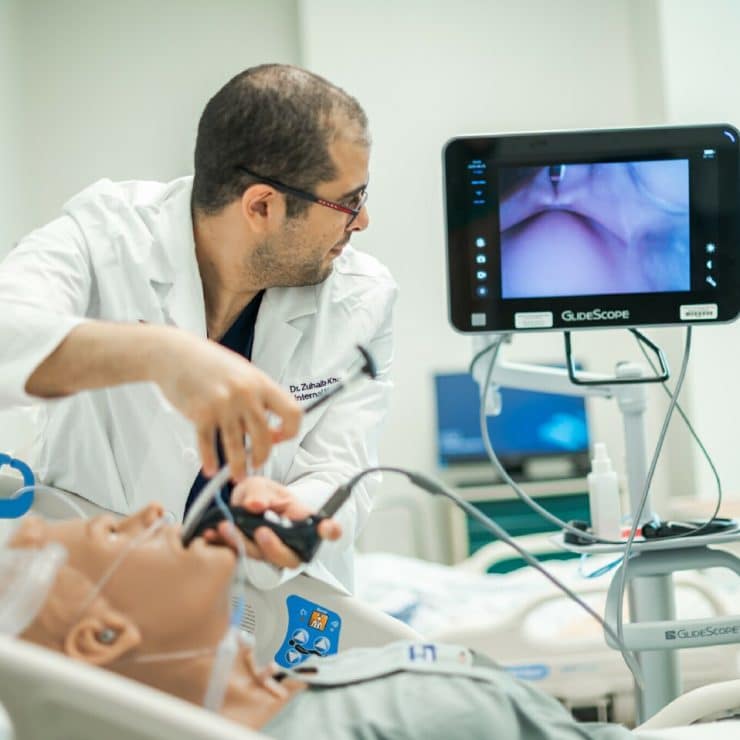 A professor demonstrates medical techniques