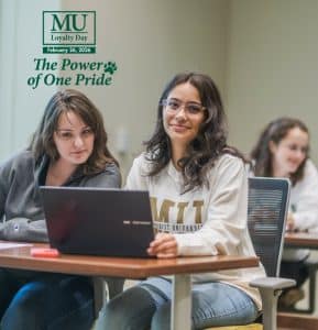 Students in class with the Methodist University Loyalty Day logo