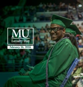 A student at graduation with the Methodist University Loyalty Day logo