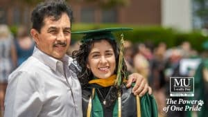 A student at graduation with the Methodist University Loyalty Day logo