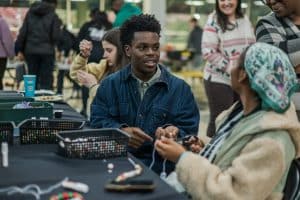 Students make necklaces