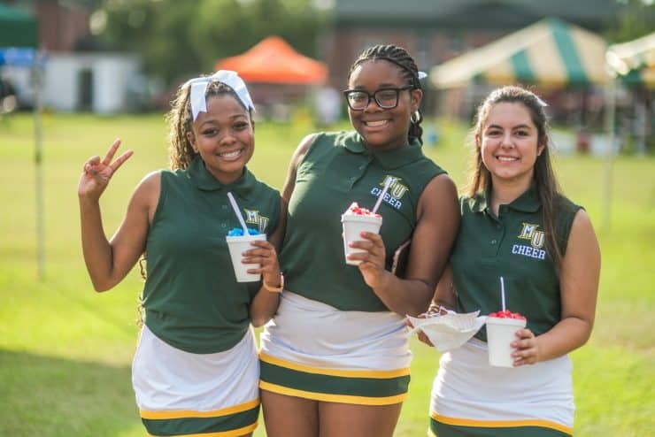 Monarch Cheerleaders holding slushies