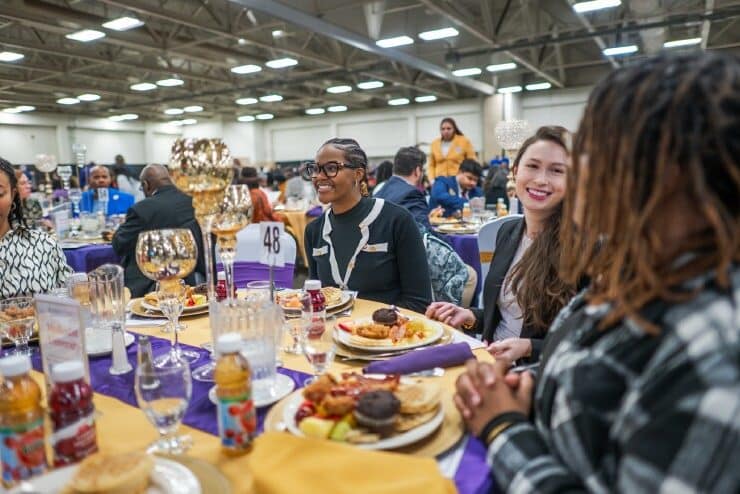 Jehari Jacobs at the 2026 MLK Brunch along with other MU students.