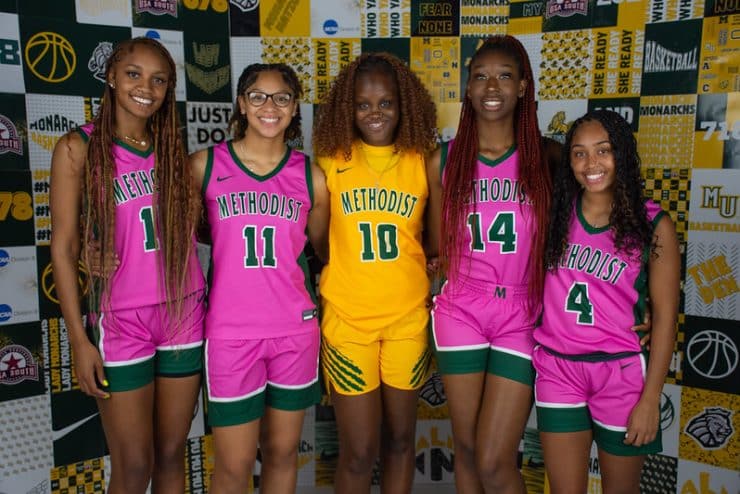 Women's Basketball players in Play4Kay pink uniforms