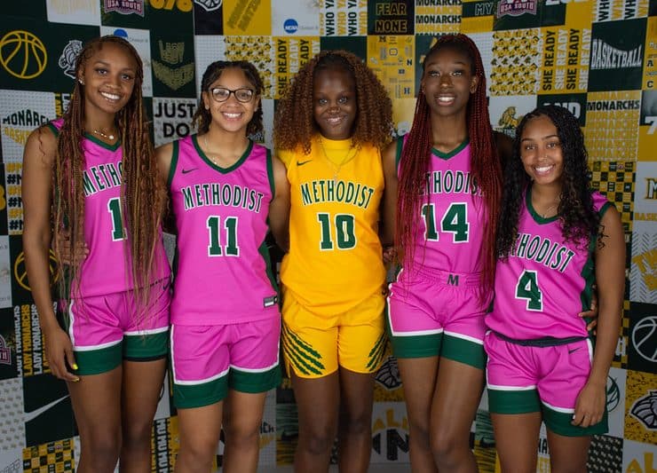 Women's Basketball players in Play4Kay pink uniforms