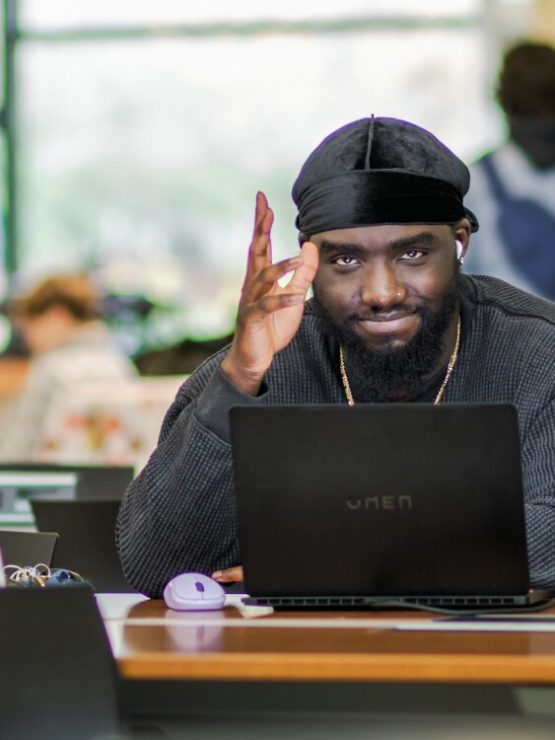 A student works on his laptop