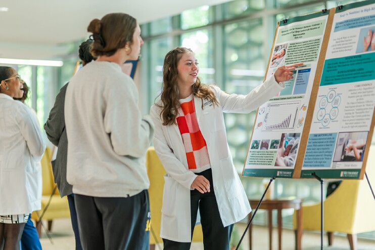 Bailey Snow presents her poster at the 15th CRC Symposium