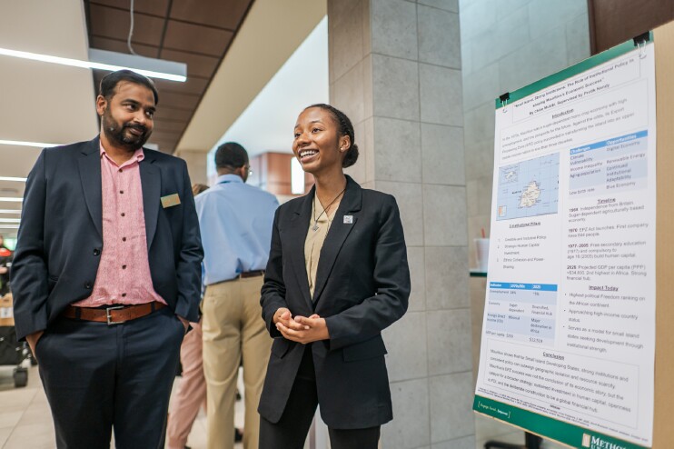 A student presents her poster at the 15th CRC Symposium