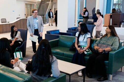 Dr. Hershey Bell greets new medical students