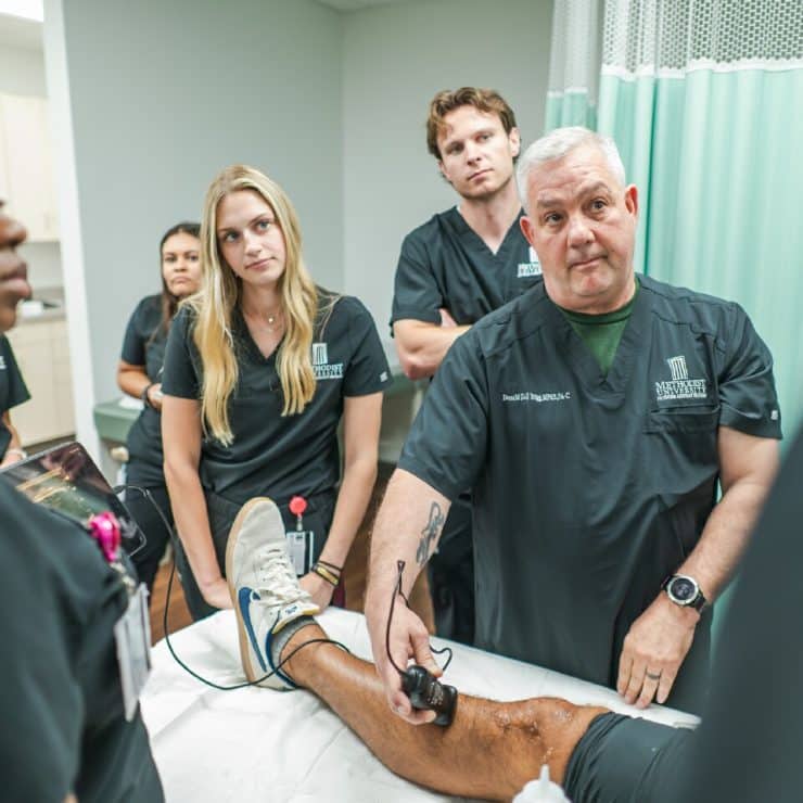 Students and faculty in a medical classroom