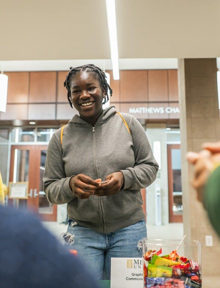 A prospective student and parent at Fall Open House