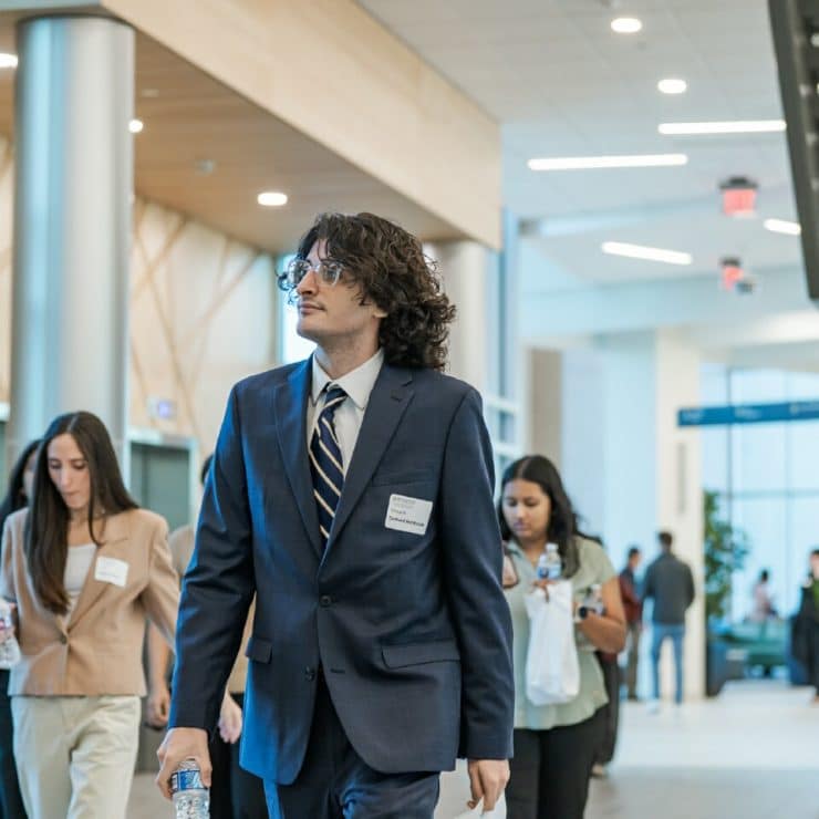 A prospective student arrives at the School of Medicine Open House